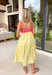 If summer were a dress, this would be it! This sleeveless midi is bursting with cheerful color and playful detail. The pink and red striped bodice features a scalloped neckline that adds the sweetest feminine touch, while the adjustable self-tie straps let you customize the fit just the way you like. The yellow and white skirt brings a bold, sunshine-inspired contrast that feels fresh and fun. 