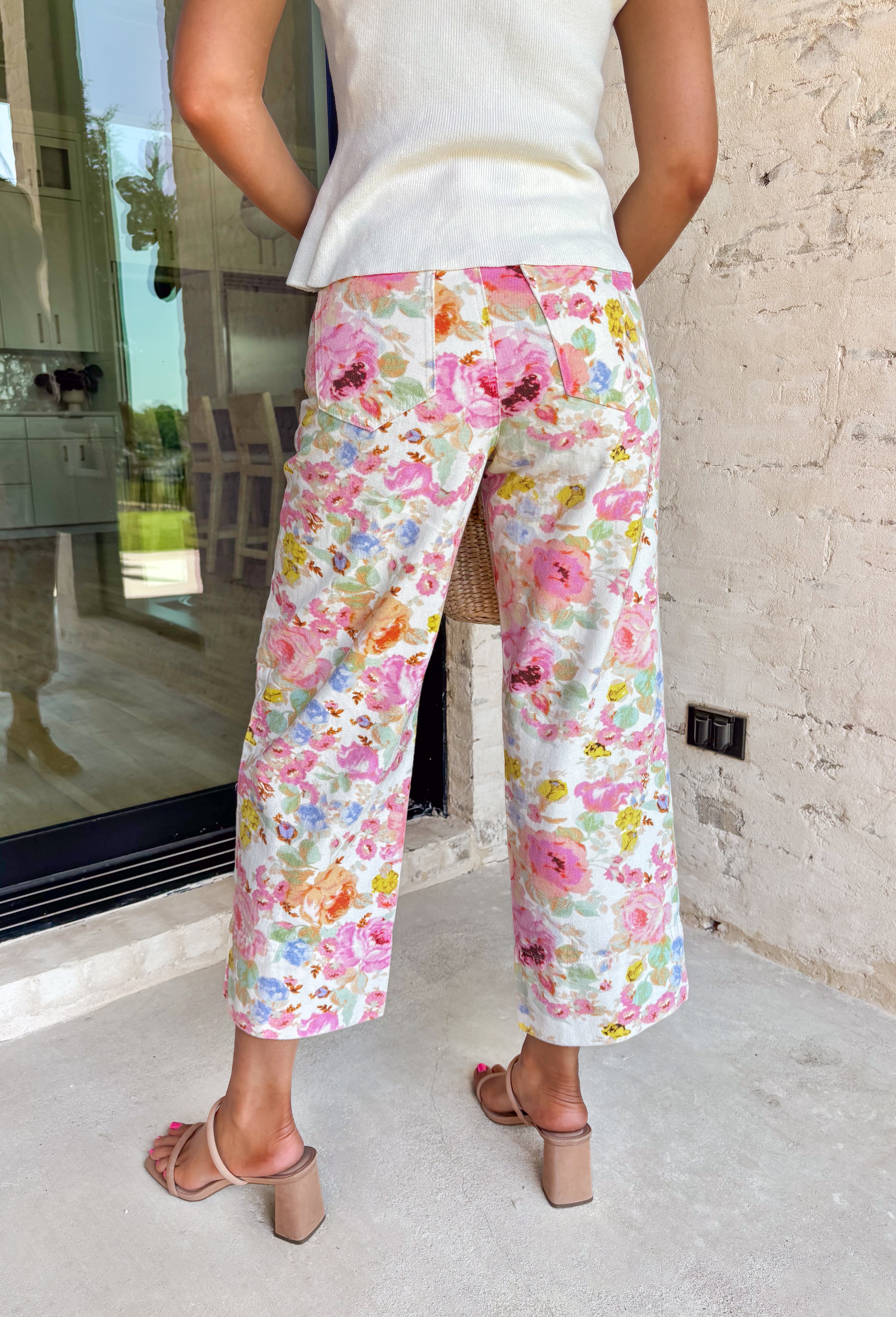 These floral print wide leg pants are such a fun, standout piece for summer! The neutral base paired with pops of pink, green, blue, and orange creates a fresh, colorful look that instantly elevates your outfit. Designed with a flattering wide leg fit, they’re lightweight, breathable, and perfect for warm days when you still want to feel put together. The patch pockets and classic zip fly keep them functional and easy to wear. 