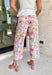 These floral print wide leg pants are such a fun, standout piece for summer! The neutral base paired with pops of pink, green, blue, and orange creates a fresh, colorful look that instantly elevates your outfit. Designed with a flattering wide leg fit, they’re lightweight, breathable, and perfect for warm days when you still want to feel put together. The patch pockets and classic zip fly keep them functional and easy to wear. 