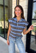 Cozy meets colorful in this sweater cardigan that's made for fall. Featuring a sky blue, black, and crisp white stripes, this soft knit adds the perfect pop of seasonal color to your wardrobe. The button front gives you the option to wear it open as a layering piece or buttoned up as a sweater, making it a versatile staple you'll reach for again and again. Finished with cap sleeves and a cozy knit feel, it's perfect for everything from workdays to weekend coffee dates and all your autumn adventures.