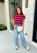 Cozy meets colorful in this sweater cardigan that's made for fall. Featuring rich burgundy, vibrant fuchsia, and crisp white stripes, this soft knit adds the perfect pop of seasonal color to your wardrobe. The button front gives you the option to wear it open as a layering piece or buttoned up as a sweater, making it a versatile staple you'll reach for again and again.