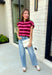 Cozy meets colorful in this sweater cardigan that's made for fall. Featuring rich burgundy, vibrant fuchsia, and crisp white stripes, this soft knit adds the perfect pop of seasonal color to your wardrobe. The button front gives you the option to wear it open as a layering piece or buttoned up as a sweater, making it a versatile staple you'll reach for again and again.