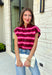 Cozy meets colorful in this sweater cardigan that's made for fall. Featuring rich burgundy, vibrant fuchsia, and crisp white stripes, this soft knit adds the perfect pop of seasonal color to your wardrobe. The button front gives you the option to wear it open as a layering piece or buttoned up as a sweater, making it a versatile staple you'll reach for again and again.