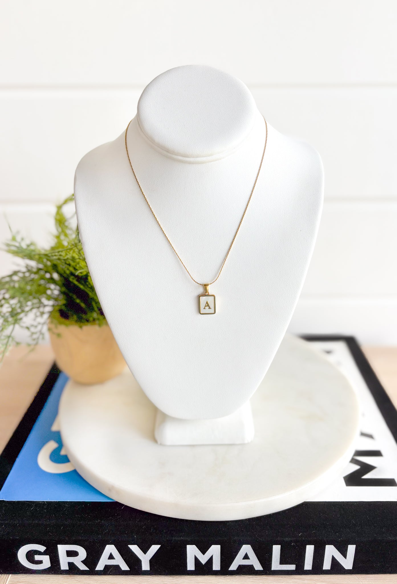 Say My Name Initial Necklace, thin gold chain necklace with pearlized charm with gold edges and gold initial in the center