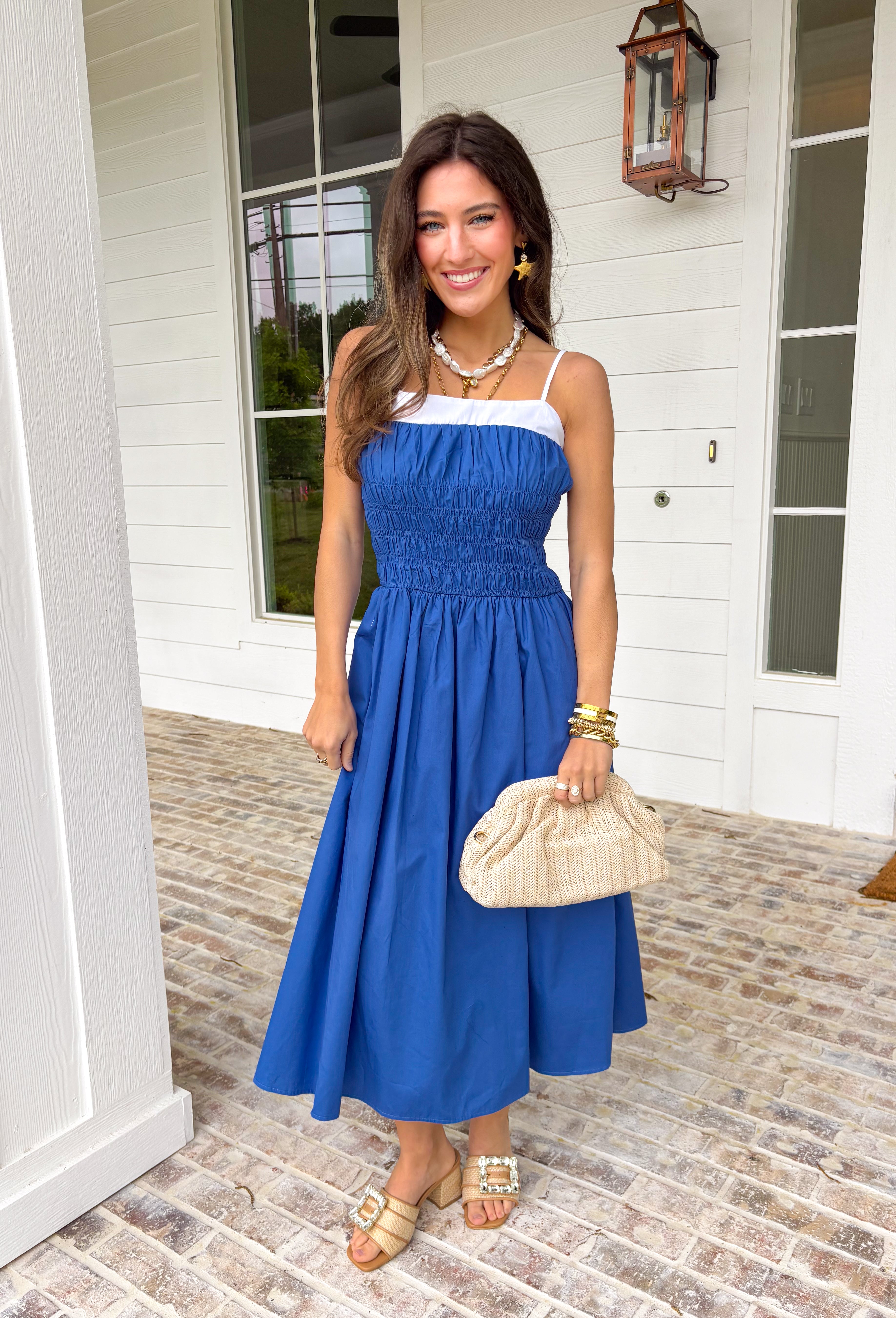 Easy, breezy, and made for sunshine-filled days! This blue sleeveless midi dress features crisp white trim along the top for a fresh pop of contrast that keeps the look clean and classic. Adjustable straps allow you to customize the fit, while smocking at the waist and back creates a flattering shape with comfortable stretch. The lightweight cotton fabric keeps it breathable, and of course it has side pockets — because we know that’s a must. Fully lined for easy wear.