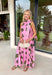 Vacation vibes meet spring sweetness in this light pink midi dress by Entro. Featuring a playful green palm print throughout, this dress is made for sunny days, brunch plans, and warm-weather getaways. The halter neckline with a tie detail adds a flirty, feminine touch, while the fully lined design keeps it comfortable and easy to wear. Side pockets make it even better (because functional can still be cute), and the lightweight tencel blend gives it that breezy, elevated feel.