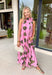 Vacation vibes meet spring sweetness in this light pink midi dress by Entro. Featuring a playful green palm print throughout, this dress is made for sunny days, brunch plans, and warm-weather getaways. The halter neckline with a tie detail adds a flirty, feminine touch, while the fully lined design keeps it comfortable and easy to wear. Side pockets make it even better (because functional can still be cute), and the lightweight tencel blend gives it that breezy, elevated feel.