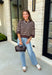 Wrap yourself in effortless fall style with this cozy striped sweater. Featuring a rich brown knit with timeless ivory stripes, this relaxed sweater is the perfect blend of classic and casual. Exposed seam details give it a laid-back feel, while the 3/4-length sleeves make it an easy piece to wear from the first cool mornings of the season through crisp autumn afternoons. Finished with a ribbed neckline, hem, and cuffs, it's a sweater you'll find yourself reaching for again and again.