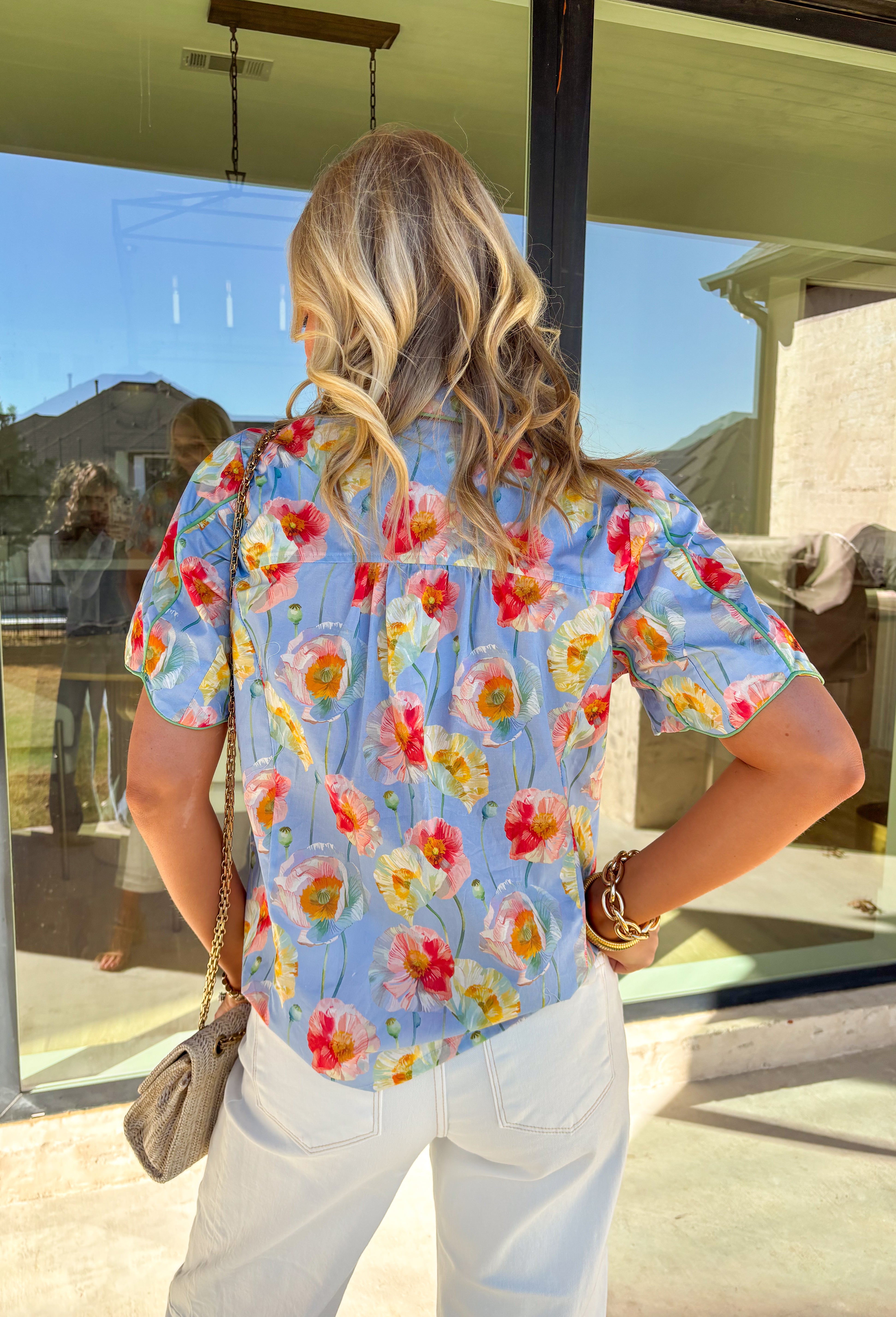 Light, cheerful, and made for sunny days, this light blue button-down top by Umgee is a springtime favorite. Featuring a colorful floral print in shades of green, mustard, and pink, this top brings an easy pop of color to your everyday wardrobe. The collared neckline keeps it classic, while the scalloped sleeves add a sweet, feminine touch that feels perfect for the season.