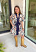 This navy floral dress is giving fall fabulous in the best way. With bold neutral blooms in cream, tan, teal, and brown, it’s the kind of that's perfect for any special occasion. The button-down design and matching self-tie waist keep things polished, while puff sleeves and navy trim down the front add a little extra charm.&nbsp;