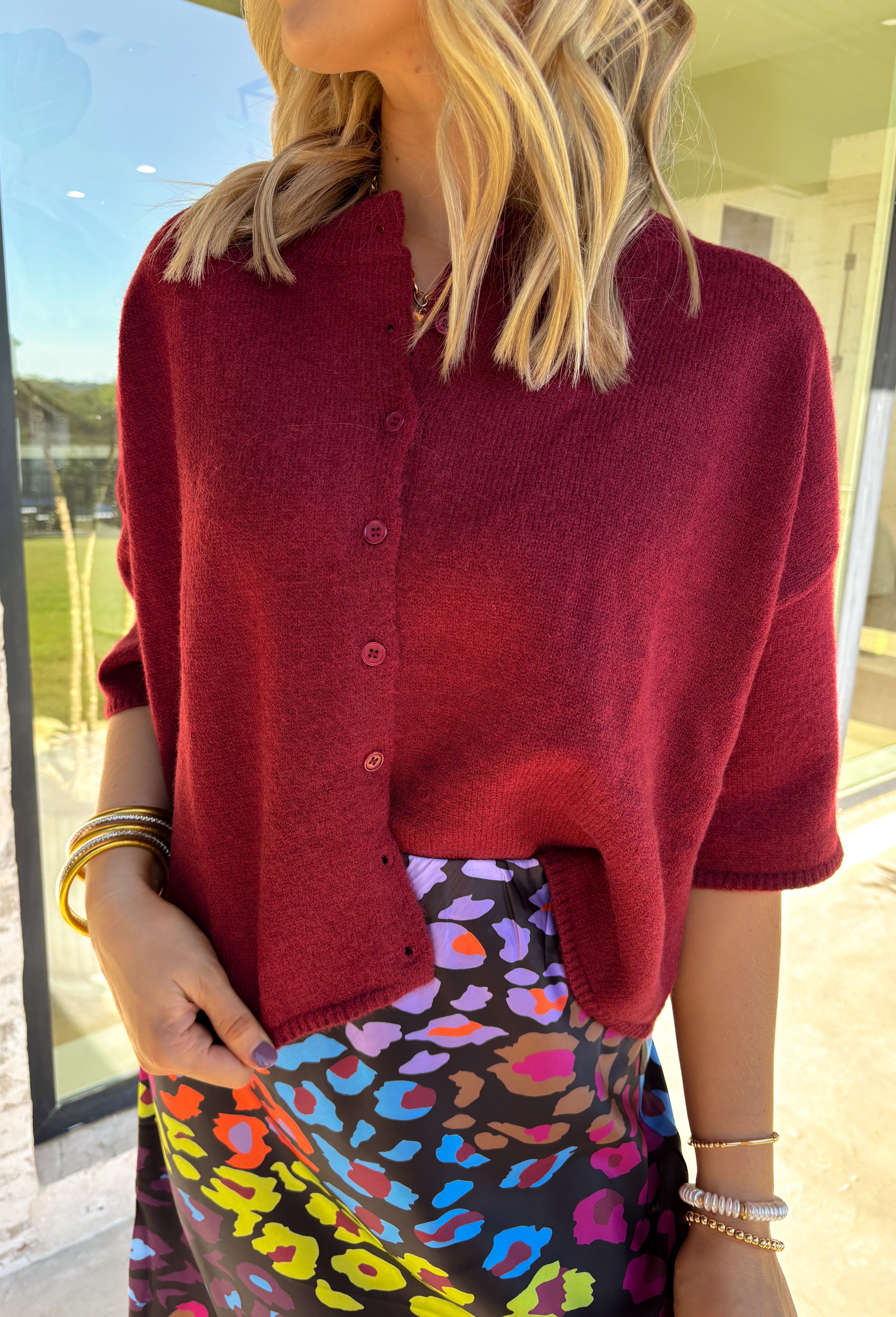 Cozy up in style with this burgundy sweater knit top—designed with a button-front closure and wide ¾ length sleeves for an effortlessly relaxed feel. The rich autumn hue makes it perfect for layering all season long, whether you're grabbing a pumpkin latte or heading into the office. Trust us, this one’s as comfy as it is cute!