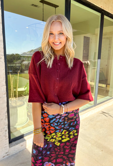 Cozy up in style with this burgundy sweater knit top—designed with a button-front closure and wide ¾ length sleeves for an effortlessly relaxed feel. The rich autumn hue makes it perfect for layering all season long, whether you're grabbing a pumpkin latte or heading into the office. Trust us, this one’s as comfy as it is cute!