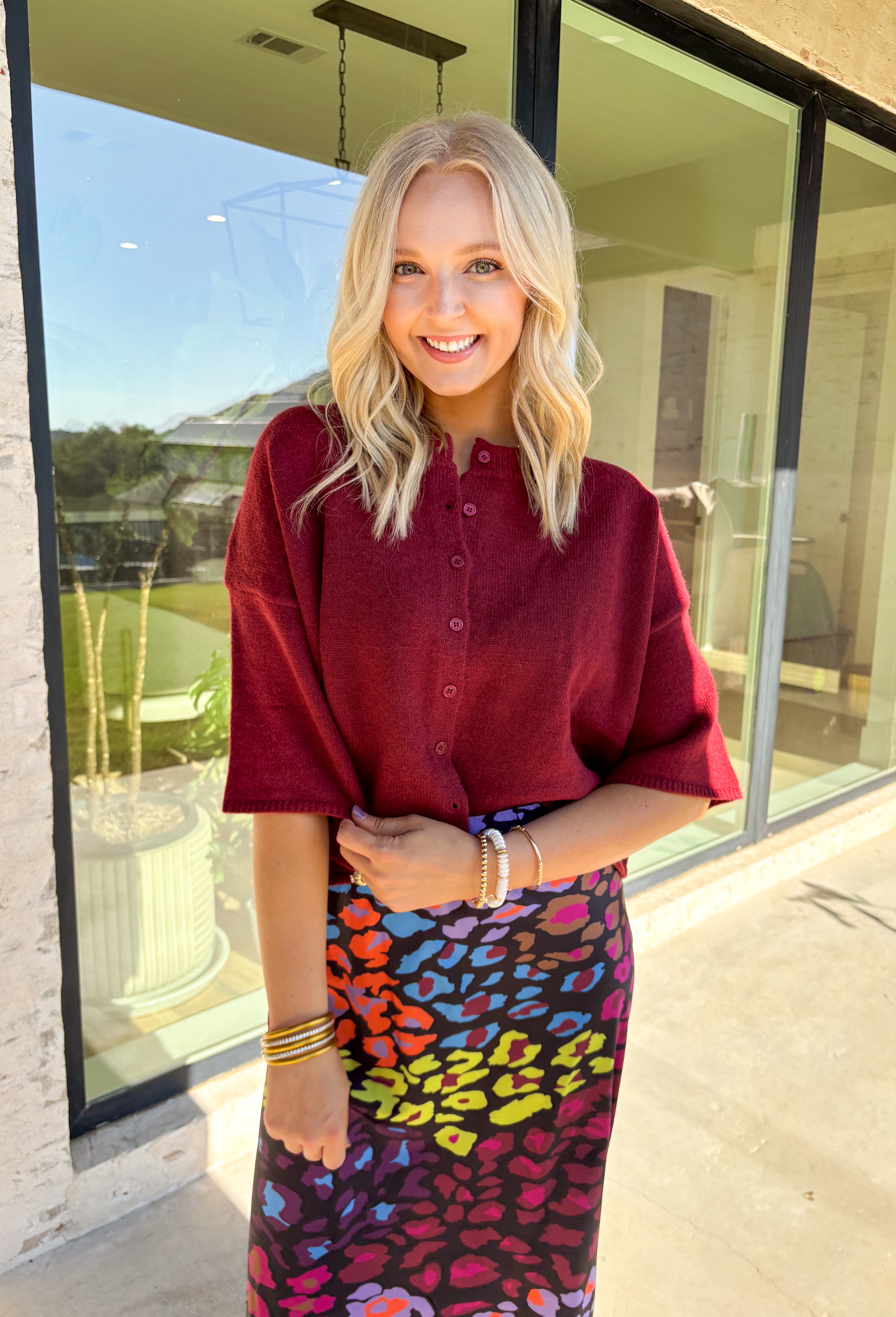 Cozy up in style with this burgundy sweater knit top—designed with a button-front closure and wide ¾ length sleeves for an effortlessly relaxed feel. The rich autumn hue makes it perfect for layering all season long, whether you're grabbing a pumpkin latte or heading into the office. Trust us, this one’s as comfy as it is cute!