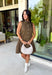 Timeless style meets feminine charm in this adorable mini dress from Entro. Crafted from soft brown denim with a classic off-white polka dot print, this sleeveless dress is full of thoughtful details you'll love. The attached neck tie adds a polished, vintage-inspired touch, while the button-front design creates an effortlessly classic silhouette. Finished with side pockets and breathable cotton fabric, this versatile dress is perfect for everything from brunch dates to weekend adventures all season long.