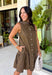 Timeless style meets feminine charm in this adorable mini dress from Entro. Crafted from soft brown denim with a classic off-white polka dot print, this sleeveless dress is full of thoughtful details you'll love. The attached neck tie adds a polished, vintage-inspired touch, while the button-front design creates an effortlessly classic silhouette. Finished with side pockets and breathable cotton fabric, this versatile dress is perfect for everything from brunch dates to weekend adventures all season long.