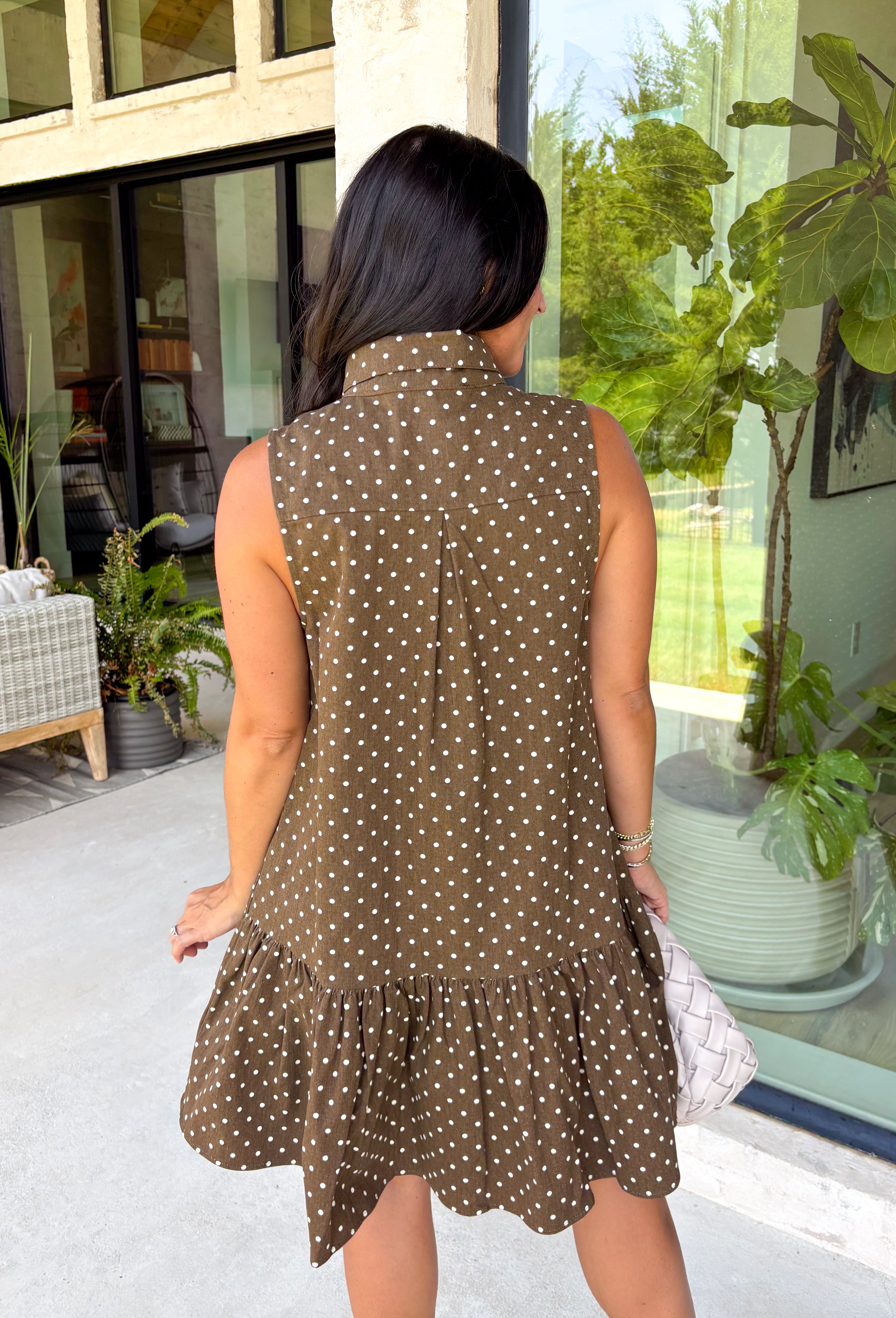 Timeless style meets feminine charm in this adorable mini dress from Entro. Crafted from soft brown denim with a classic off-white polka dot print, this sleeveless dress is full of thoughtful details you'll love. The attached neck tie adds a polished, vintage-inspired touch, while the button-front design creates an effortlessly classic silhouette. Finished with side pockets and breathable cotton fabric, this versatile dress is perfect for everything from brunch dates to weekend adventures all season long.