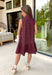 Timeless style meets feminine charm in this adorable mini dress from Entro. Crafted from burgundy denim with a classic off-white polka dot print, this sleeveless dress is full of thoughtful details you'll love. The attached neck tie adds a polished, vintage-inspired touch, while the button-front design creates an effortlessly classic silhouette. Finished with side pockets and breathable cotton fabric, this versatile dress is perfect for everything from brunch dates to weekend adventures all season long.