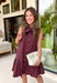 Timeless style meets feminine charm in this adorable mini dress from Entro. Crafted from burgundy denim with a classic off-white polka dot print, this sleeveless dress is full of thoughtful details you'll love. The attached neck tie adds a polished, vintage-inspired touch, while the button-front design creates an effortlessly classic silhouette. Finished with side pockets and breathable cotton fabric, this versatile dress is perfect for everything from brunch dates to weekend adventures all season long.