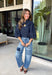 Give your denim collection a fresh twist with this dark wash blouse from Entro. The lightweight cotton fabric keeps it comfortable and easy to wear, while the rich dark wash feels right at home as fall transitions into winter. A high neckline with a self-tie detail adds a pretty focal point, complemented by gold button detailing along the front. The ¾ puff sleeves bring a little volume to the silhouette without making it feel overly dressy. 
