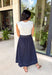 This sleeveless midi dress is the definition of effortless summer style! With its white top and navy skirt design, it gives you that perfectly layered look without any extra effort. The self-tie belt with white threading detail adds a flattering touch at the waist, while the matching detail along the hem pulls everything together beautifully. Lightweight, lined, and finished with side pockets, it’s as practical as it is polished. 