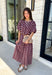 Effortlessly coordinated and beautifully feminine, this matching set is made for all your favorite fall occasions! Featuring a rich maroon hue with delicate off white floral embroidery, this two-piece outfit makes getting dressed easy while still looking polished. The short sleeve top is finished with a comfortable elastic hem, while the coordinating midi skirt features an elastic waistband for an easy, flattering fit. 