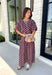 Effortlessly coordinated and beautifully feminine, this matching set is made for all your favorite fall occasions! Featuring a rich maroon hue with delicate off white floral embroidery, this two-piece outfit makes getting dressed easy while still looking polished. The short sleeve top is finished with a comfortable elastic hem, while the coordinating midi skirt features an elastic waistband for an easy, flattering fit. 