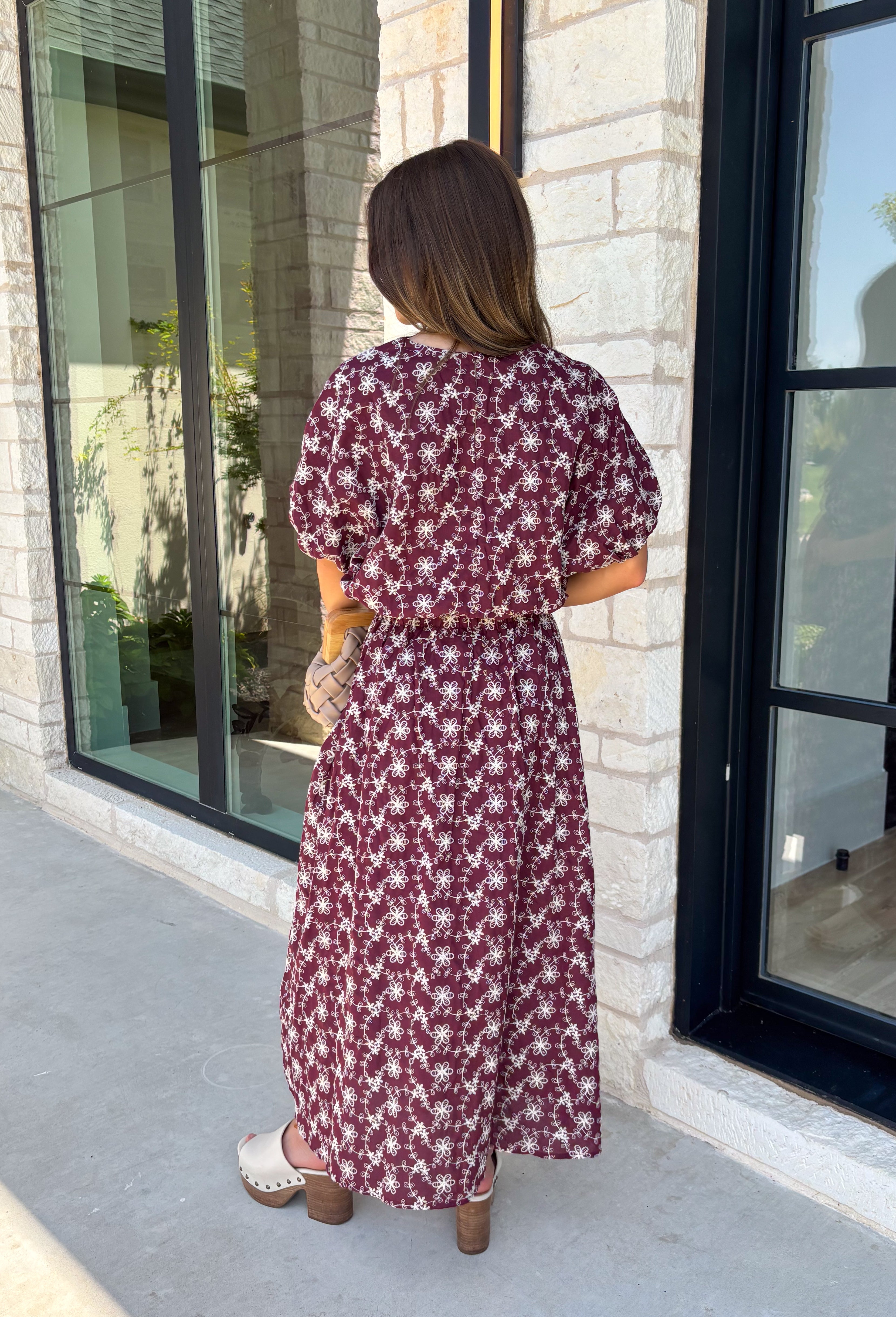 Effortlessly coordinated and beautifully feminine, this matching set is made for all your favorite fall occasions! Featuring a rich maroon hue with delicate off white floral embroidery, this two-piece outfit makes getting dressed easy while still looking polished. The short sleeve top is finished with a comfortable elastic hem, while the coordinating midi skirt features an elastic waistband for an easy, flattering fit. 
