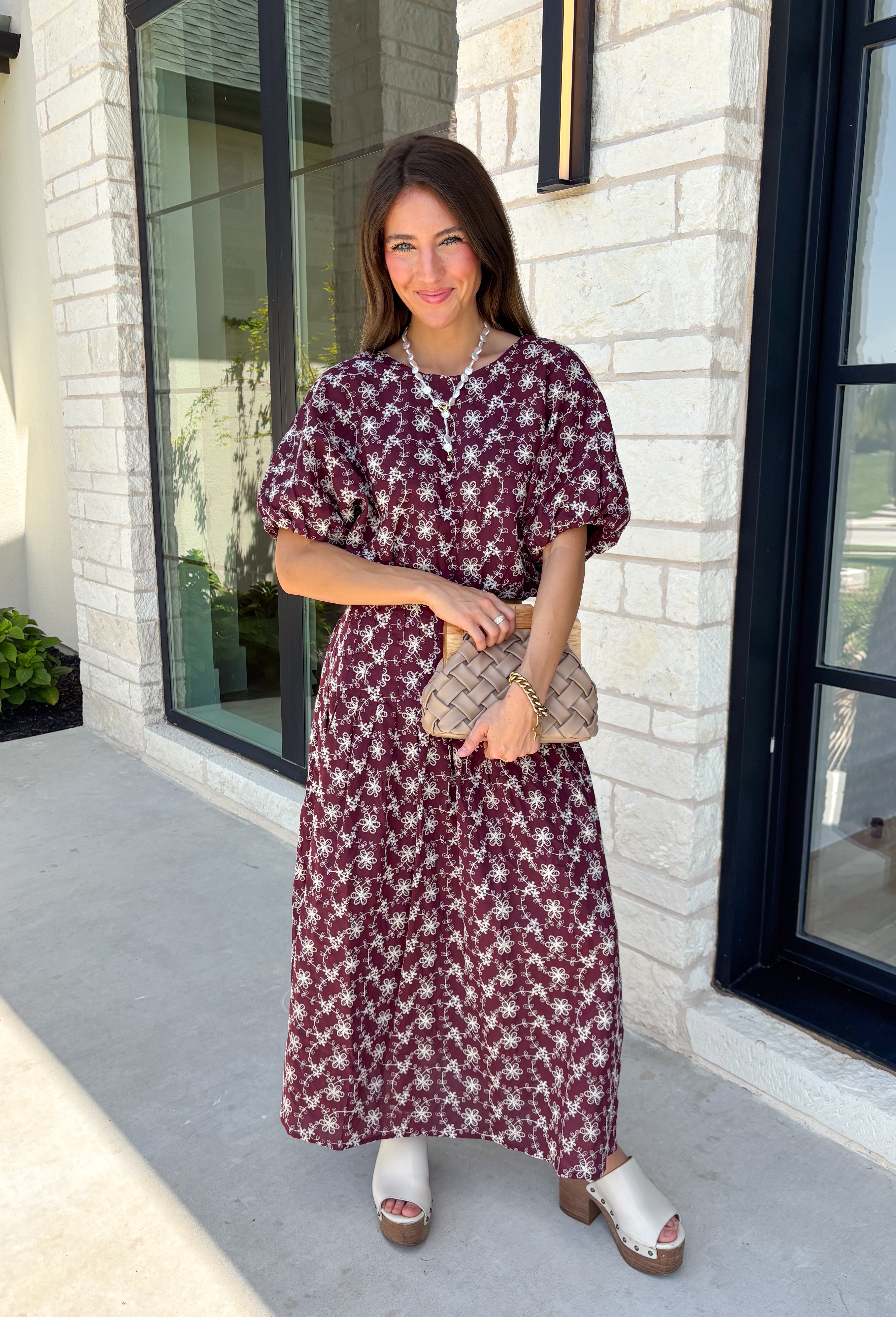 Effortlessly coordinated and beautifully feminine, this matching set is made for all your favorite fall occasions! Featuring a rich maroon hue with delicate off white floral embroidery, this two-piece outfit makes getting dressed easy while still looking polished. The short sleeve top is finished with a comfortable elastic hem, while the coordinating midi skirt features an elastic waistband for an easy, flattering fit. 