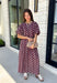 Effortlessly coordinated and beautifully feminine, this matching set is made for all your favorite fall occasions! Featuring a rich maroon hue with delicate off white floral embroidery, this two-piece outfit makes getting dressed easy while still looking polished. The short sleeve top is finished with a comfortable elastic hem, while the coordinating midi skirt features an elastic waistband for an easy, flattering fit. 