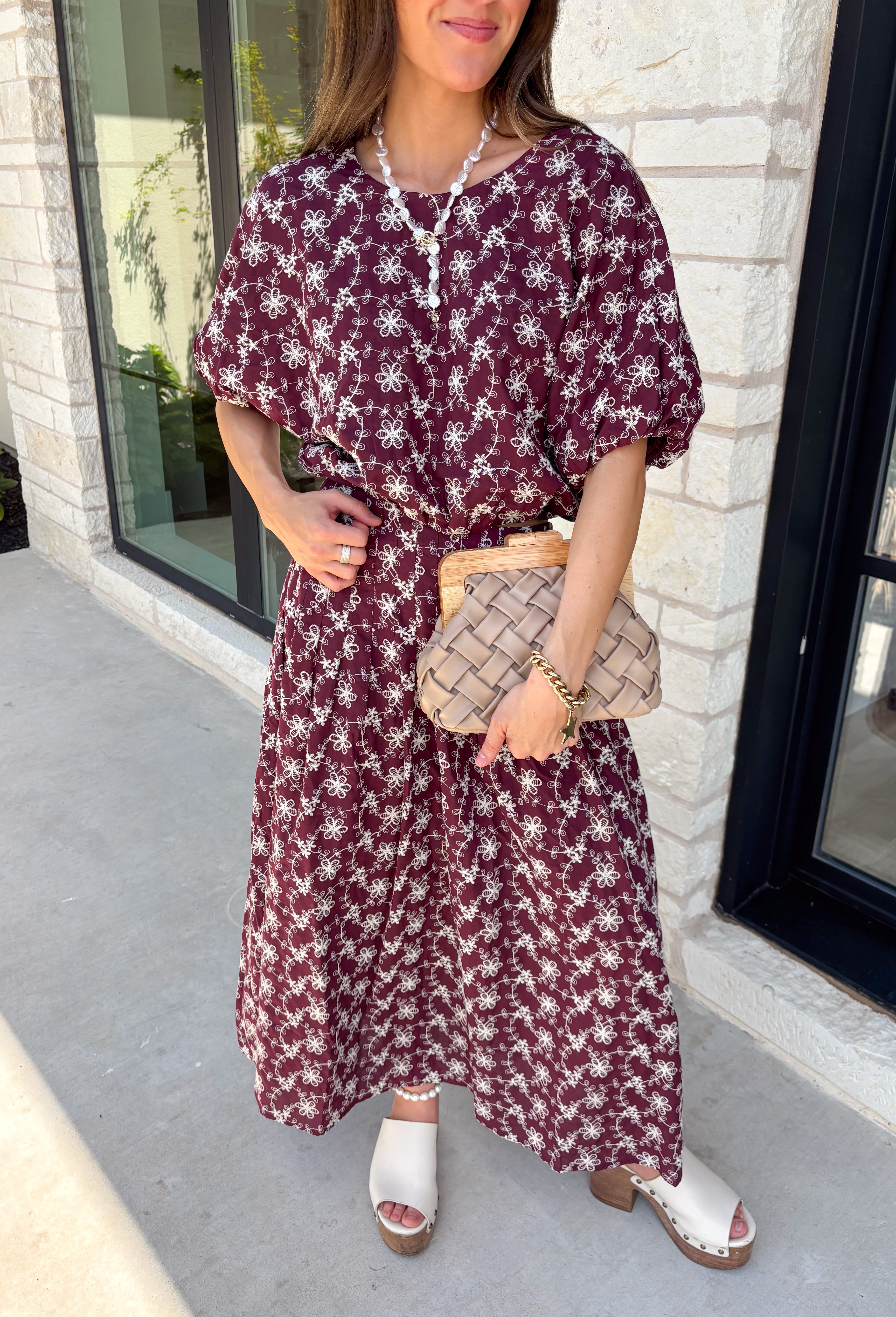 Effortlessly coordinated and beautifully feminine, this matching set is made for all your favorite fall occasions! Featuring a rich maroon hue with delicate off white floral embroidery, this two-piece outfit makes getting dressed easy while still looking polished. The short sleeve top is finished with a comfortable elastic hem, while the coordinating midi skirt features an elastic waistband for an easy, flattering fit. 