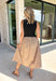 Sophisticated style meets everyday comfort in this stunning mixed media midi dress! Featuring a sleek black mock neck bodice paired with a beautifully flowing tan skirt, this dress creates an effortlessly polished look that's perfect for the season ahead. Finished with a back zipper closure and a fully lined skirt, this versatile dress is ready for everything from office meetings and brunch dates to fall weddings and special occasions.