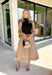 Sophisticated style meets everyday comfort in this stunning mixed media midi dress! Featuring a sleek black mock neck bodice paired with a beautifully flowing tan skirt, this dress creates an effortlessly polished look that's perfect for the season ahead. Finished with a back zipper closure and a fully lined skirt, this versatile dress is ready for everything from office meetings and brunch dates to fall weddings and special occasions.