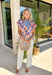 This colorful floral top is pure sunshine in clothing form! With its bright, happy print, it instantly lifts your whole outfit and mood. The blue and white trim along the neckline adds a fun contrast detail, while the puff sleeves give it that soft, feminine shape that’s so easy to wear. Lightweight with a comfortable stretch, it’s perfect for warm days when you want something cheerful and effortless. 