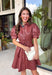 Make a statement this fall in this stunning dusty rose faux leather dress. The rich faux leather finish brings an elevated touch, while the feminine details keep the look soft and timeless. Featuring delicate floral eyelet sleeves with puff shoulders, a flattering self-tie waist, and a classic collared neckline, this dress perfectly blends sophistication with everyday wearability. 