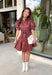 Make a statement this fall in this stunning dusty rose faux leather dress. The rich faux leather finish brings an elevated touch, while the feminine details keep the look soft and timeless. Featuring delicate floral eyelet sleeves with puff shoulders, a flattering self-tie waist, and a classic collared neckline, this dress perfectly blends sophistication with everyday wearability. 