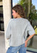 This light grey cardigan is the perfect layering piece for the season ahead! The soft knit and timeless button down design make it a wardrobe staple you'll reach for again and again. A crisp white stripe along the sleeves adds a subtle varsity-inspired touch, while the ribbed hem and sleeve cuffs create a polished finish. Wear it buttoned as a sweater or layered over your favorite basics for endless styling possibilities.