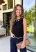 Timeless, polished, and endlessly versatile, this sweater tank from Day + Moon is a piece you'll reach for season after season. Designed in a classic black knit, it features beautiful ivory contrast trim along the neckline and arm openings for a refined touch. The ivory scalloped hem adds the perfect feminine finish, making this sleeveless sweater just as pretty worn on its own as it is layered under jackets and cardigans.