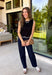 Timeless, polished, and endlessly versatile, this sweater tank from Day + Moon is a piece you'll reach for season after season. Designed in a classic black knit, it features beautiful ivory contrast trim along the neckline and arm openings for a refined touch. The ivory scalloped hem adds the perfect feminine finish, making this sleeveless sweater just as pretty worn on its own as it is layered under jackets and cardigans.
