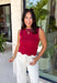 Classic with a touch of charm, this crimson sweater tank is made for the season ahead. The rich autumn hue is beautifully accented with crisp white trim and a delicate scalloped hem, creating a timeless look that's both polished and playful. Crafted from a soft sweater knit, it's perfect for layering under your favorite blazer, denim jacket, or cardigan as the temperatures begin to cool. 
