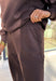 Stay cozy in style with these chocolate brown barrel joggers by Rae Mode. Lined in soft fleece and finished with a drawstring elastic waistband, these joggers offer the perfect blend of comfort and warmth for chilly winter days. Featuring side and back pockets for everyday convenience, their relaxed barrel silhouette makes them ideal for lounging or layering on the go. Pair them with the matching quarter-zip pullover for a complete cozy set or wear them solo for a laid-back, stylish look.