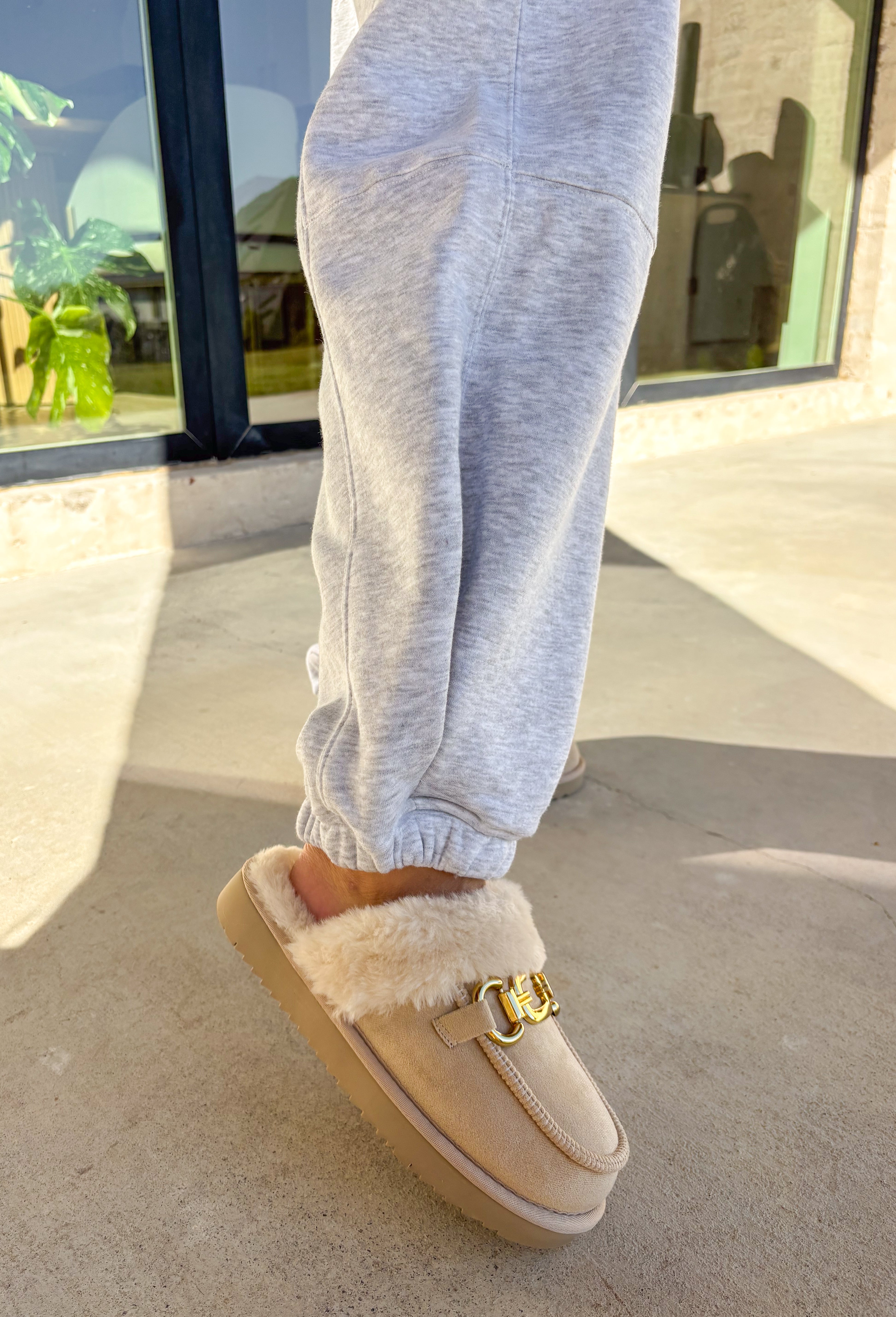 Stay cozy in style with these heather gray barrel joggers by Rae Mode. Lined in soft fleece and finished with a drawstring elastic waistband, these joggers offer the perfect blend of comfort and warmth for chilly winter days. Featuring side and back pockets for everyday convenience, their relaxed barrel silhouette makes them ideal for lounging or layering on the go. Pair them with the matching quarter-zip pullover for a complete cozy set or wear them solo for a laid-back, stylish look.