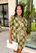 Classic plaid meets delicate florals in this charming dress from Entro. Designed with an olive plaid backdrop and a beautiful neutral floral print, this timeless piece is full of feminine details you'll love. The ruffled accent neck band collar adds an elegant touch, while the button-front closure and puff sleeves create an effortlessly polished silhouette. 