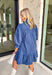 Corduroy gets a feminine refresh in this denim blue long sleeve dress. Designed with a tiered skirt for easy movement, it’s finished with front button details and a soft ruffle neckline that adds charm to the look. Smocked ruffle sleeves bring a cozy touch while keeping the fit comfortable, and the all-cotton construction makes it breathable enough for all-day wear. A perfect mix of texture and timeless design, this dress is a seasonal staple.