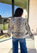 Stay warm and stylish all season long in this neutral leopard button-down cardigan by Fate. Designed with a classic collared neckline and chest pockets, this cozy knit adds the perfect touch of winter charm to any outfit. The soft, textured feel makes it an easy go-to for chilly days, while the leopard print keeps things fun and fashion-forward.
