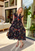 This black floral midi dress is basically a spring celebration you can wear! The colorful allover print pops beautifully against the black background, while the pink scalloped neckline and sleeves add the cutest little feminine touch. With a tiered skirt that moves like a dream and handy side pockets (because we love a practical moment), this one is made for everything from brunch dates to baby showers to twirling through the farmer’s market. You will find yourself reaching for this dress all season long!