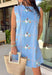 Sweet, sunny, and perfect for spring, this chambray sleeveless dress by Entro is full of charming detail. Designed with colorful floral embroidery in coral, white, navy, and green, it adds a beautiful pop against the soft chambray base. Scalloped trim along the neckline and sleeves gives it a delicate, feminine finish, while the button closure at the back adds a subtle touch of interest. Fully lined and complete with side pockets.