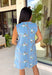 Sweet, sunny, and perfect for spring, this chambray sleeveless dress by Entro is full of charming detail. Designed with colorful floral embroidery in coral, white, navy, and green, it adds a beautiful pop against the soft chambray base. Scalloped trim along the neckline and sleeves gives it a delicate, feminine finish, while the button closure at the back adds a subtle touch of interest. Fully lined and complete with side pockets.