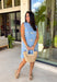 Sweet, sunny, and perfect for spring, this chambray sleeveless dress by Entro is full of charming detail. Designed with colorful floral embroidery in coral, white, navy, and green, it adds a beautiful pop against the soft chambray base. Scalloped trim along the neckline and sleeves gives it a delicate, feminine finish, while the button closure at the back adds a subtle touch of interest. Fully lined and complete with side pockets.