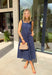Timeless, feminine, and effortlessly polished! This navy midi dress features a classic white polka dot print that never goes out of style. The square neckline creates a flattering, structured silhouette, while the sleeveless design keeps it light and perfect for warm days. Smocking along the back bodice provides comfortable stretch and a beautiful fit, while the back zipper closure keeps the look clean and tailored. Finished with side pockets and breathable cotton fabric.