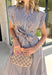 Rich autumn hues and timeless details make this striped midi dress an easy favorite for the season ahead. Featuring light blue and brown stripes, this dress captures everything we love about fall. The flattering v-neckline is finished with a sweet self-tie detail, while the gathered waist creates a feminine silhouette that's both comfortable and flattering. Cap sleeves, side pockets, and a fully lined design make it as practical as it is stylish. 